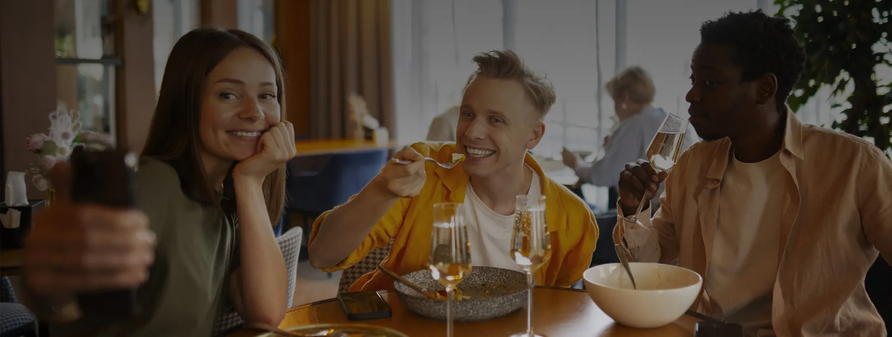 Restaurant diners enjoying a meal at a table